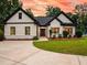 Attractive single-story home featuring a well-manicured lawn and contemporary black-framed windows, radiating curb appeal at 3640 Pollys Blf, Cumming, GA 30028