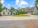 Spacious home with a long driveway, well-manicured lawn and beautiful landscaping at 3640 Pollys Blf, Cumming, GA 30028