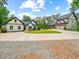 Beautiful two-story home with a long driveway, well-manicured lawn and landscaping at 3640 Pollys Blf, Cumming, GA 30028