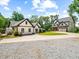 Beautiful, landscaped homes with a long driveway and well-manicured lawn at 3640 Pollys Blf, Cumming, GA 30028