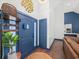 Stylish foyer featuring a blue door, modern accents, and hardwood floors at 3640 Pollys Blf, Cumming, GA 30028