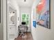 Hallway with natural light, features a desk area, and access to a bathroom at 3640 Pollys Blf, Cumming, GA 30028