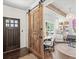 Home office featuring a custom wood sliding door and beamed ceilings at 3640 Pollys Blf, Cumming, GA 30028