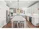 Modern kitchen features white cabinets, stainless steel appliances, and a center island at 3640 Pollys Blf, Cumming, GA 30028