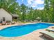 Inviting backyard pool with lounge chairs and an outdoor TV sitting area at 3640 Pollys Blf, Cumming, GA 30028