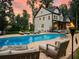 Relaxing poolside view featuring lounge chairs, outdoor seating, and a well-manicured lawn with a beautiful sky at 3640 Pollys Blf, Cumming, GA 30028