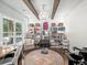 Bright salon room with beamed ceiling, salon chairs, and natural light from large windows at 3640 Pollys Blf, Cumming, GA 30028