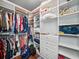 Walk-in closet with ample shelving, drawers, and storage for clothes and accessories at 3640 Pollys Blf, Cumming, GA 30028