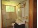 Damaged bathroom with peeling wallpaper at 5114 Fawn Se Trl, Mableton, GA 30126