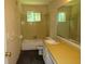 Outdated bathroom with a yellow countertop and tile at 5114 Fawn Se Trl, Mableton, GA 30126