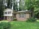View of the two-story home showing the brick and siding exterior and front yard at 5114 Fawn Se Trl, Mableton, GA 30126