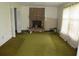 View of the living room showcasing a brick fireplace, carpet, and natural light at 5114 Fawn Se Trl, Mableton, GA 30126