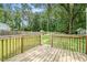A view from the wooden back deck with railing overlooking a grassy yard and shed at 96 S Forty Pass S, Hiram, GA 30141