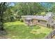 Well-maintained backyard with a screened-in porch, a deck, a swing, and a fenced yard at 96 S Forty Pass S, Hiram, GA 30141