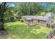 Well-maintained backyard with a screened-in porch, a deck, a swing, and a fenced yard at 96 S Forty Pass S, Hiram, GA 30141