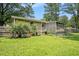 A view of the back of the house, deck, screened porch, and a large grassy backyard at 96 S Forty Pass S, Hiram, GA 30141