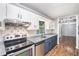 Well-appointed kitchen with stainless appliances, stone countertops, and ample cabinet space at 96 S Forty Pass S, Hiram, GA 30141