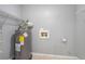Compact laundry room featuring water heater, hook ups, and wire shelving at 96 S Forty Pass S, Hiram, GA 30141