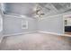 Large living room with modern ceiling design, plush carpeting, and ample natural light from windows at 96 S Forty Pass S, Hiram, GA 30141