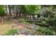 Backyard view of firepit and wooded area at 1788 River Bluff Vw, Duluth, GA 30097