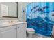 Clean white bathroom with dolphin shower curtain, and a vanity with chrome fixtures at 1788 River Bluff Vw, Duluth, GA 30097