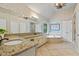 Large bathroom featuring granite countertops, a soaking tub, and beautiful decor at 1788 River Bluff Vw, Duluth, GA 30097