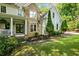 This lovely home showcases manicured landscaping, a stone facade, and a cozy porch for relaxing outdoors at 1788 River Bluff Vw, Duluth, GA 30097