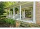 Inviting front porch with ample seating and charming details, perfect for enjoying the outdoors at 1788 River Bluff Vw, Duluth, GA 30097