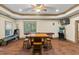 Finished basement/game room with wooden floors, pool table and gaming consoles at 1788 River Bluff Vw, Duluth, GA 30097