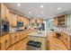 Spacious kitchen with custom wood cabinets, granite countertops, stainless steel appliances, and center island at 1788 River Bluff Vw, Duluth, GA 30097