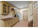 Kitchenette with wooden cabinets and countertops, microwave and refrigerator at 1788 River Bluff Vw, Duluth, GA 30097