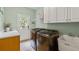 Bright laundry room with stainless washer and dryer plus access to the backyard at 1788 River Bluff Vw, Duluth, GA 30097
