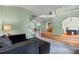 Open-concept living space showcases a comfortable sofa and seamless transition to the dining area and kitchen at 1788 River Bluff Vw, Duluth, GA 30097