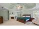 A spacious primary bedroom features a trey ceiling, fireplace, and a cozy chair at 1788 River Bluff Vw, Duluth, GA 30097