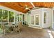 Outdoor screened porch with wood ceiling, peaceful ambiance, and seamless transition to indoor/outdoor living at 1788 River Bluff Vw, Duluth, GA 30097