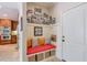 Inviting entryway features a built-in bench with storage and a gallery wall of Gathering photos at 205 Northampton Ct, Canton, GA 30115