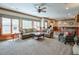 Spacious basement living room with an accent wall of windows at 205 Northampton Ct, Canton, GA 30115