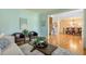 Stylish living room with hardwood floors, a decorative rug, comfortable seating, and bright lighting at 205 Northampton Ct, Canton, GA 30115