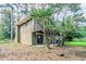 Backyard featuring a small deck, a concrete patio, and mature trees at 2110 Redbud Sw Ct, Marietta, GA 30008