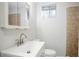 Bathroom featuring a white vanity with sink, mirror, and tiled wall details at 2110 Redbud Sw Ct, Marietta, GA 30008