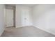 Cozy bedroom with carpeted floor, neutral paint, a closet, and a window at 2110 Redbud Sw Ct, Marietta, GA 30008