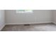 Neutral bedroom with a window and carpet flooring at 2110 Redbud Sw Ct, Marietta, GA 30008