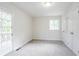 Bright bedroom featuring carpeted floor, neutral paint, a window, and closet at 2110 Redbud Sw Ct, Marietta, GA 30008