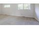 Bright bedroom features neutral walls, carpet, and windows with outside views at 2110 Redbud Sw Ct, Marietta, GA 30008