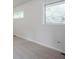 Bright bedroom features neutral walls, carpet, and windows with outside views at 2110 Redbud Sw Ct, Marietta, GA 30008