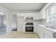 Charming kitchen with stainless steel appliances and white cabinetry at 2110 Redbud Sw Ct, Marietta, GA 30008