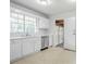 View of kitchen with white cabinets and stainless steel dishwasher at 2110 Redbud Sw Ct, Marietta, GA 30008