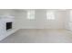 Spacious living room with a fireplace and two windows at 2110 Redbud Sw Ct, Marietta, GA 30008