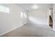 Bright living room with carpeted floor, neutral paint, a window, and stairs at 2110 Redbud Sw Ct, Marietta, GA 30008