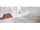 Open concept living room with hardwood floors and view of kitchen at 2110 Redbud Sw Ct, Marietta, GA 30008